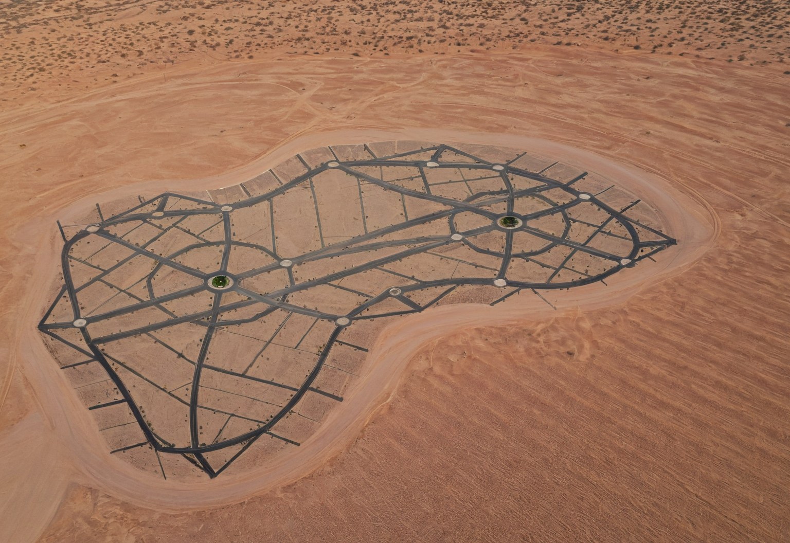 The freshly marked road network on graded desert at golden hour